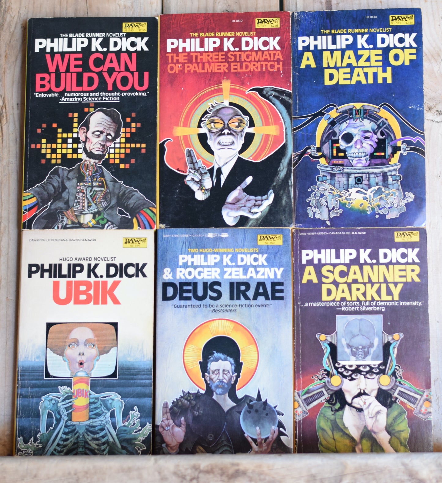 Vintage Sci-Fi Paperbacks: Philip K Dick - DAW Bob Pepper Covers Set: A Scanner Darkly, Deus Irae, Ubik, A Maze of Death, The three Stigmata of Palmer Eldrich and We Can Build You
